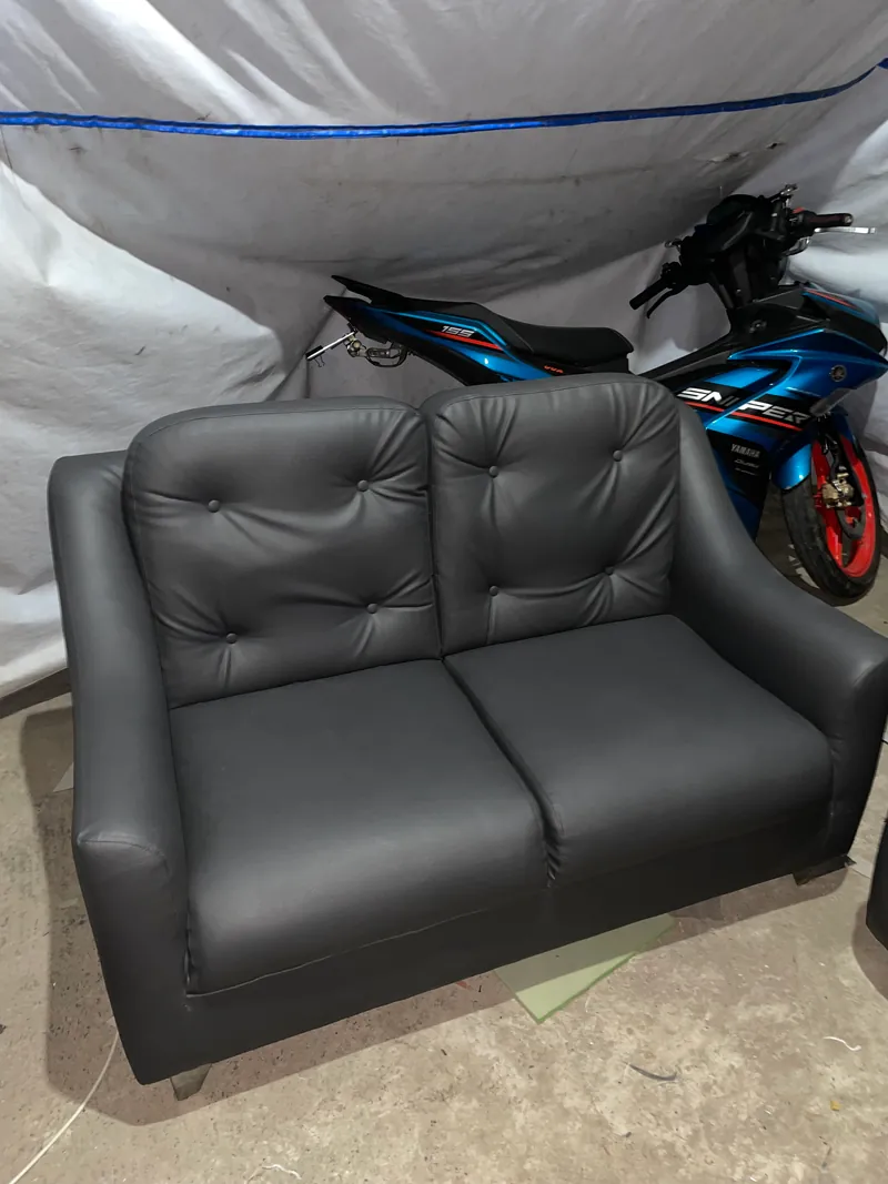     Charcoal gray 2-seater leatherette sofa right angle view