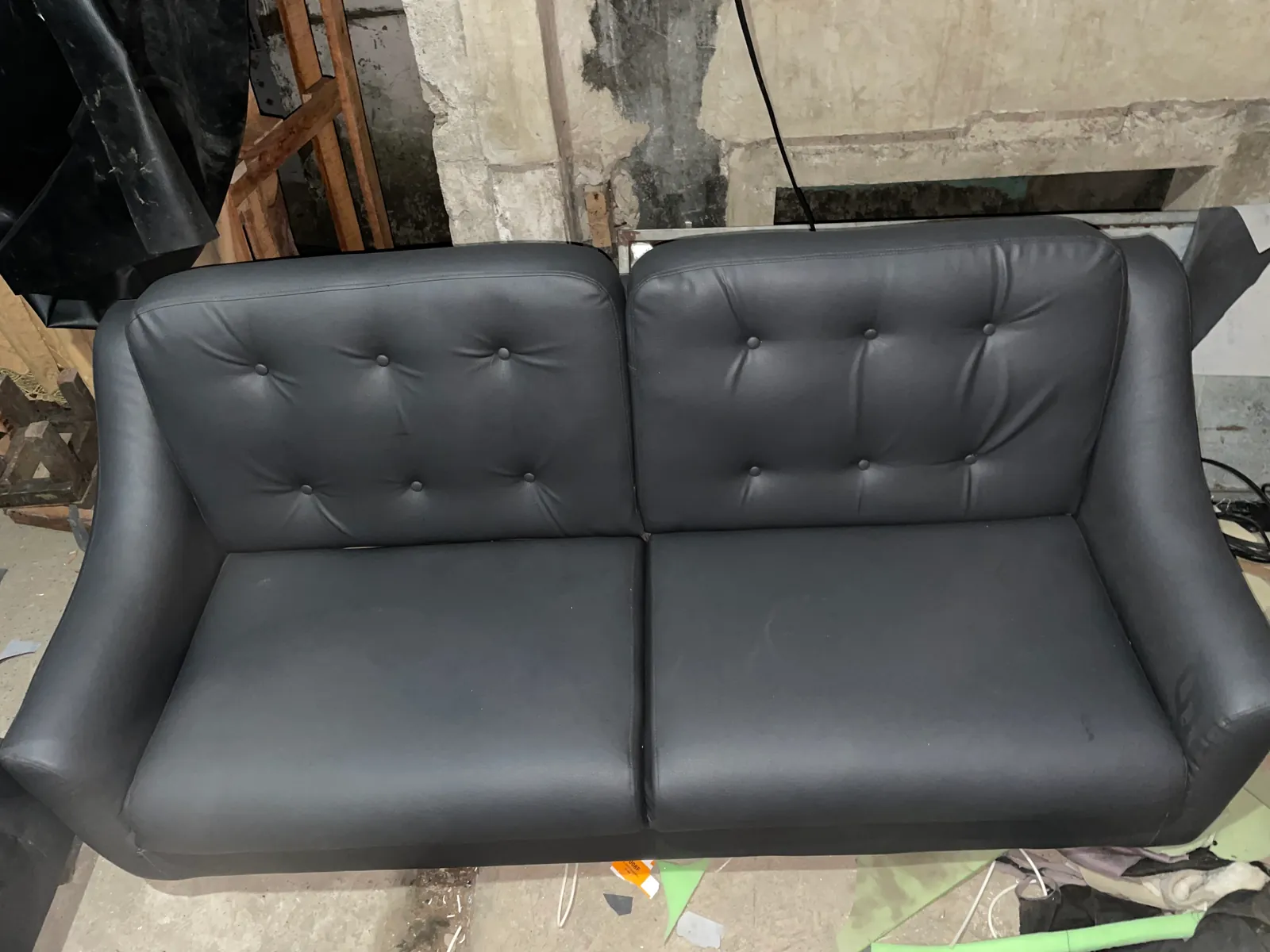    Charcoal gray 2-seater button tufted leatherette sofa front view